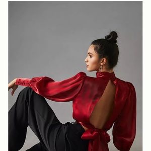 Beautiful open back brand new silky blouse from Anthropologie. New with tags